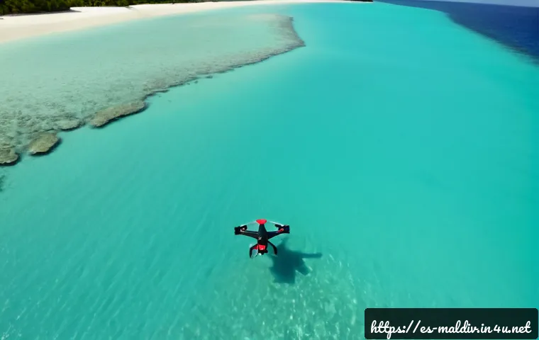 몰디브 드론 촬영 팁 - Photorealistic aerial travel scene of a small camera drone hovering above a calm turquoise Maldivian...